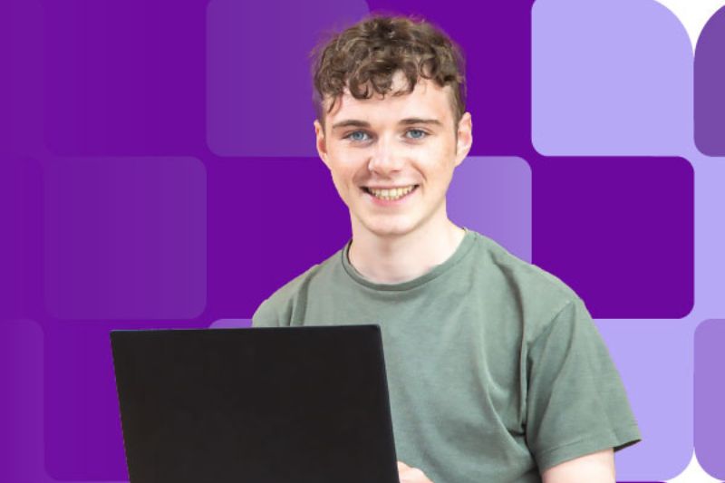 male student on laptop with a purple background